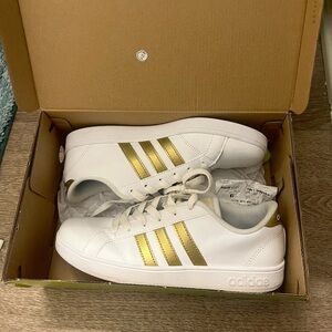 White & gold striped Adidas Neo Baseline K shoes. Size 5 boys, 6 1/2 women